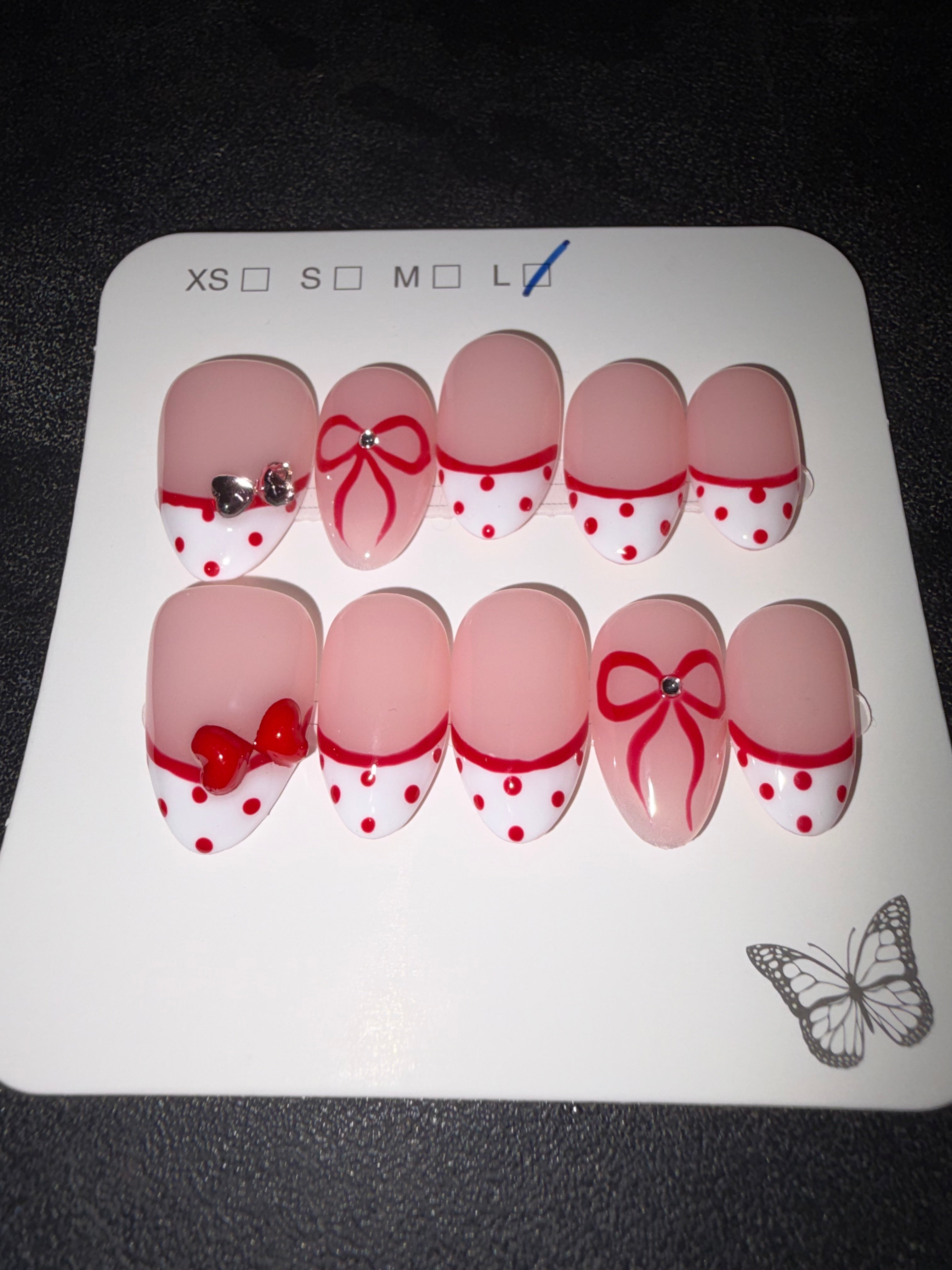 Red and white dotted French press on nails