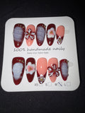 Red floral French press on nails
